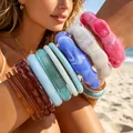 Colorful stacked acrylic irregular bangle bracelets on model arm in beach lifestyle - Exaggerated Irregular Style (6756501HB) / Mixed Multicolor Combo