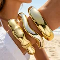 Set of three irregular chunky gold acrylic open bangles with a high-polished finish - Metallic Open Style (6762701HB) / Bright Gold Combo