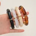 Set of 4 chunky acrylic tube bracelets in black, marble white, beige, and amber colors - 4-Piece Irregular Tube Bangle Set (6755001) / Black/Marble White/Beige/Amber Combo