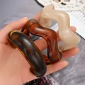 Set of three irregular wavy acrylic open bangles with marble and tortoiseshell patterns. - 3-Piece Irregular Wave Bangle Set (6689201HB) / Dark Brown/Amber/Beige Marble