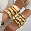 Exaggerated chunky gold irregular open bangle set with a premium metallic glossy finish - Multi-Piece High-Shine Mirror Bangle Set (6706201HB) / Gold