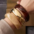 Elegant set of chunky acrylic and irregular gold metallic open bangles for women - 3-Piece Irregular Heavy Bangle Set (6754501) / Amber/Gold/Beige Combo