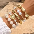 Elegant acrylic irregular gold bracelet set with heart charm and white faux pearls decor - 5-Piece Bohemian Jewelry Set (6708601HB) / Gold, White and Pearl Combo