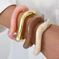 Stylish set of four oversized acrylic wavy bracelets in pink, gold, brown and cream colors - Wave Style (6685401HB) / Set of 4 / Pink and Beige Combo