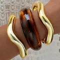 Chunky irregular gold wavy bangles and dark amber acrylic cuff bracelet jewelry set - CCB Acrylic Style (6618801HB) / Set of 3 / Gold and Amber
