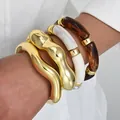 Fashionable set of irregular gold-tone bangles and acrylic resin link bracelets - Bamboo-joint Curved Bangle (6684901HB) / Set of 4 / Mixed Colors