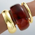 Statement acrylic and gold finish irregular bangle bracelet jewelry set for women - Smooth Bangle (6617801HB) / Set of 3 / Amber and Gold Combo