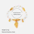 Resilient stainless steel pearl bracelet featuring a detailed golden shell pendant charm - Conch Pendant Artificial Pearl Bracelet (11)