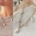 Elegant 18k gold plated titanium steel necklace featuring natural freshwater pearls detail - Necklace - Style J