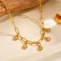 Close-up macro view of gold titanium steel necklace with five round crystal charms - White Rhinestone Necklace (F306) / Gold