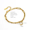 Close-up of heart-shaped zircon pendant on gold-plated stainless steel bracelet - Heart Shape (2421) / Gold