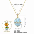 Light blue floral enamel egg locket pendant necklace in premium gold-plated copper finish - September Flower