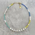 Detailed view of handmade freshwater pearl necklace with colorful seed beads - Short Choker Length / Yellow Blue Cyan