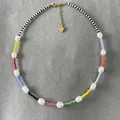 Detail showing the handmade colorful seed beads and genuine freshwater pearls necklace. - Short Choker Length / Ten-Color Patchwork