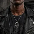 Close-up of vintage skull stainless steel pendant necklace worn with a leather jacket. - Steel Color Pendant (HT-3430) With Box Chain