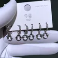 Set aus drei Paar silbernen Creolen mit glitzernden Sternanhängern aus Zirkonia-Mikropflaster - Sternen Geometrie Stil (2820)