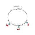Close-up detail of a sparkling rhinestone cherry charm on a silver tennis chain anklet - Rhinestone Cherry Style (S533) / Silver