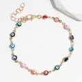Adjustable gold chain bracelet featuring colorful Evil Eye beads in various shades - Evil Eye Bracelet