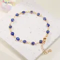 Gold-tone chain bracelet featuring blue Evil Eye beads with adjustable lobster clasp. - Blue Evil Eye Anklet