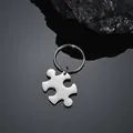 Minimalist stainless steel jigsaw puzzle piece keychain with polished silver finish. - Horizontal Puzzle Keychain / Steel