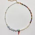 Detailed view of vintage mixed beaded necklace with pearls and red chili pendant. - Style 14 (Necklace)