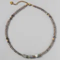 Macro view of natural stone beaded necklace with gray faceted beads and gold accents - Style 19 (Necklace)