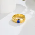 Macro view of a gold titanium steel ring featuring a brilliant blue zircon gemstone - US 7 / Blue Zirconia Gold Ring