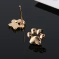 Elegantes pendientes de botón con forma de pata de gato en aleación dorada para mujer - Dorado