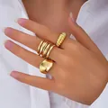 Set of chunky gold-toned gothic style geometric open finger rings worn on a hand - Gothic Wide Surface Geometric 3-Piece Set (6314801HB) / Gold