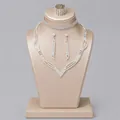 Elegant silver crystal bridal jewelry set with V-shaped necklace and earrings on stand - Versatile Photoshoot Jewelry Set (NS-J6569S) / Silver