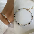 Detailed view of bohemian beaded bracelet with natural stones and pearls on white fabric. - Black, White and Pearl Combination Style (Bracelet 23)