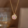 Apple-shaped copper necklace with a pink heart pendant and golden finish. - Pink Diamond Apple Pendant (9461)