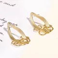 Elegantes pendientes geométricos dorados con aguja de plata 925 y detalles de borlas - Pendientes Geométricos