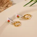 Detailed view of gold-plated ceramic teacup earrings with cute red strawberry patterns. - Strawberry Teacup