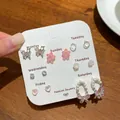 Set mit sieben Paaren rosa Schmetterlings und Blumenohrsteckern für jeden Wochentag - Rosa Kirschen Set