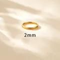 Minimalist 2mm wide gold plated stainless steel band ring with an elegant matte finish - US 4 / 2mm Brushed Gold