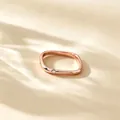 Close-up of a minimalist rose gold titanium steel square ring with a small zircon. - US 4 / Rose Gold