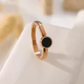 Close-up of rose gold stainless steel ring with minimalist black circular inlay detail - US 5 / 6mm Black Shell Round Ring Rose Gold J215
