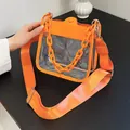 Stylish orange transparent square bag with acrylic chain handle and wide shoulder strap - Orange