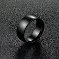 8mm glossy black stainless steel band ring for men and women on textured background - Size 6 / Black