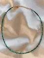 Detail showing faceted green natural stone beads on a gold-plated adjustable choker necklace - One Size / Dark Green Faceted Stone Style (Style 18)