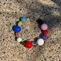Colorful irregular natural stone necklace with metal toggle clasp on textured ground - One Size / Mixed Color Bracelet