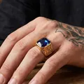 Close-up of gold Masonic ring with large rectangular blue gemstone on hand. - US 7 / Gold Blue