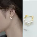 Elegant golden hoop earrings with small white freshwater pearls for a vintage look - C-Shape Freshwater Pearl Hoop Earrings