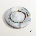 Handmade woven bracelet featuring light blue and orange semi-precious stone barrel beads - Light Blue and Orange Marble Style (BR1823-C)