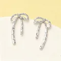 Elegant silver bow earrings with hammered texture finish for a stylish minimalist look - Textured Bowknot Stud Earring (N-040) / Silver
