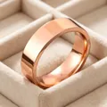Close-up of polished 6mm rose gold stainless steel ring in a beige velvet jewelry box. - Size 5 / Rose Gold