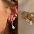 Elegante vergulde titanium stalen oorringen met natuurlijke barokke parelhangers - Waterdruppel Barokparel Stijl