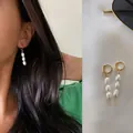 Boucles d'oreilles créoles avec trois perles baroques en acier titane plaqué or 18 carats chic - Style Pendant à Trois Perles