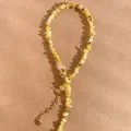 Detail van natuurlijke gele toermalijn steen ketting met gouden verlengketting - 38+5cm / Geel
